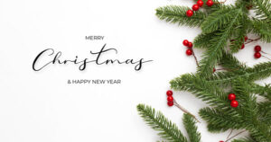 Oaks Christian Online Christmas card with pine branches and holly leaves on a white background with the words Merry Christmas Happy New Year