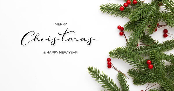 Oaks Christian Online Christmas card with pine branches and holly leaves on a white background with the words Merry Christmas & Happy New Year